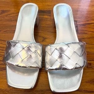 Low heeled silver sandals by Marc Fisher.